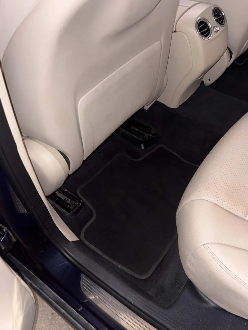Floor mat and cream leather seat after interior detail